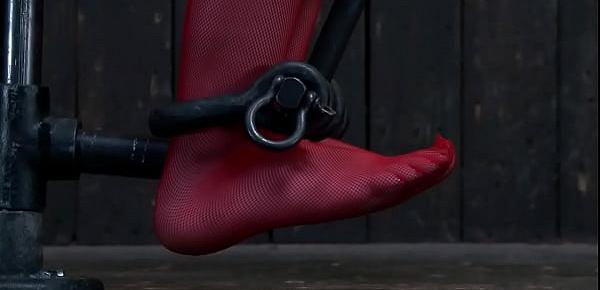 Sub bound in strappado gets whipped